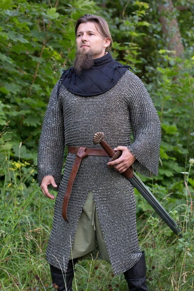Viking-age riveted iron mail hauberk reaching to the knee with short sleeves