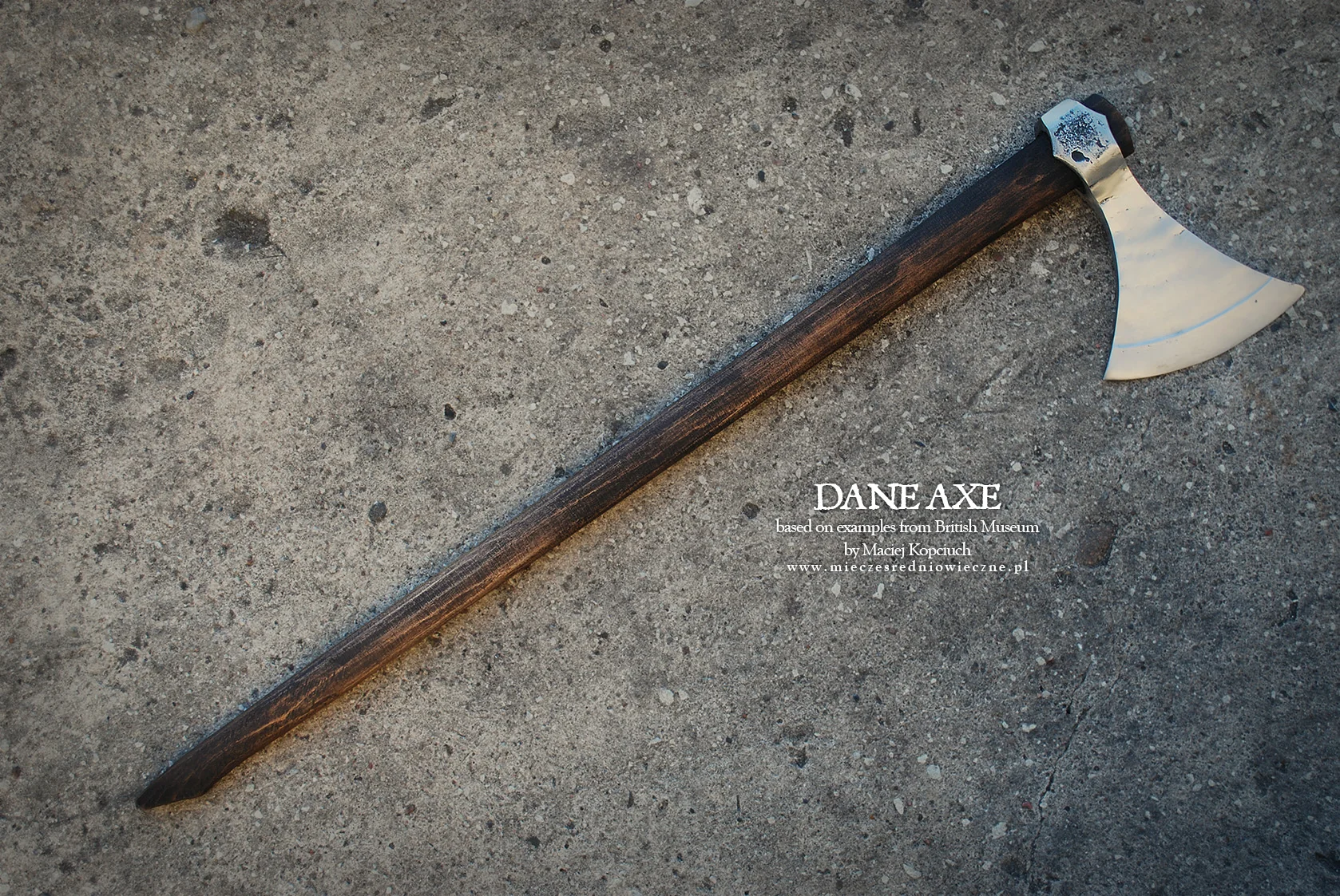 Viking-age Dane axe with broad sweeping cutting edge on a long haft