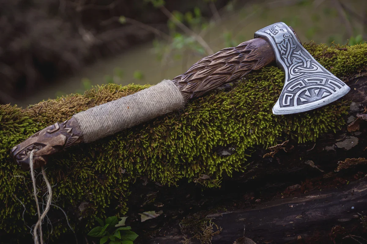 Plain Viking-age iron hand axe with short wooden haft