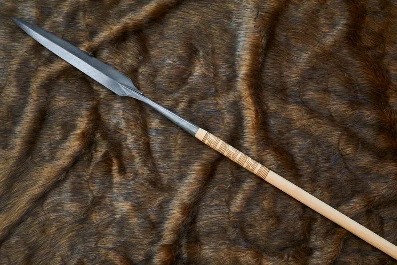 Viking-age spear with leaf-shaped iron head on an ash haft